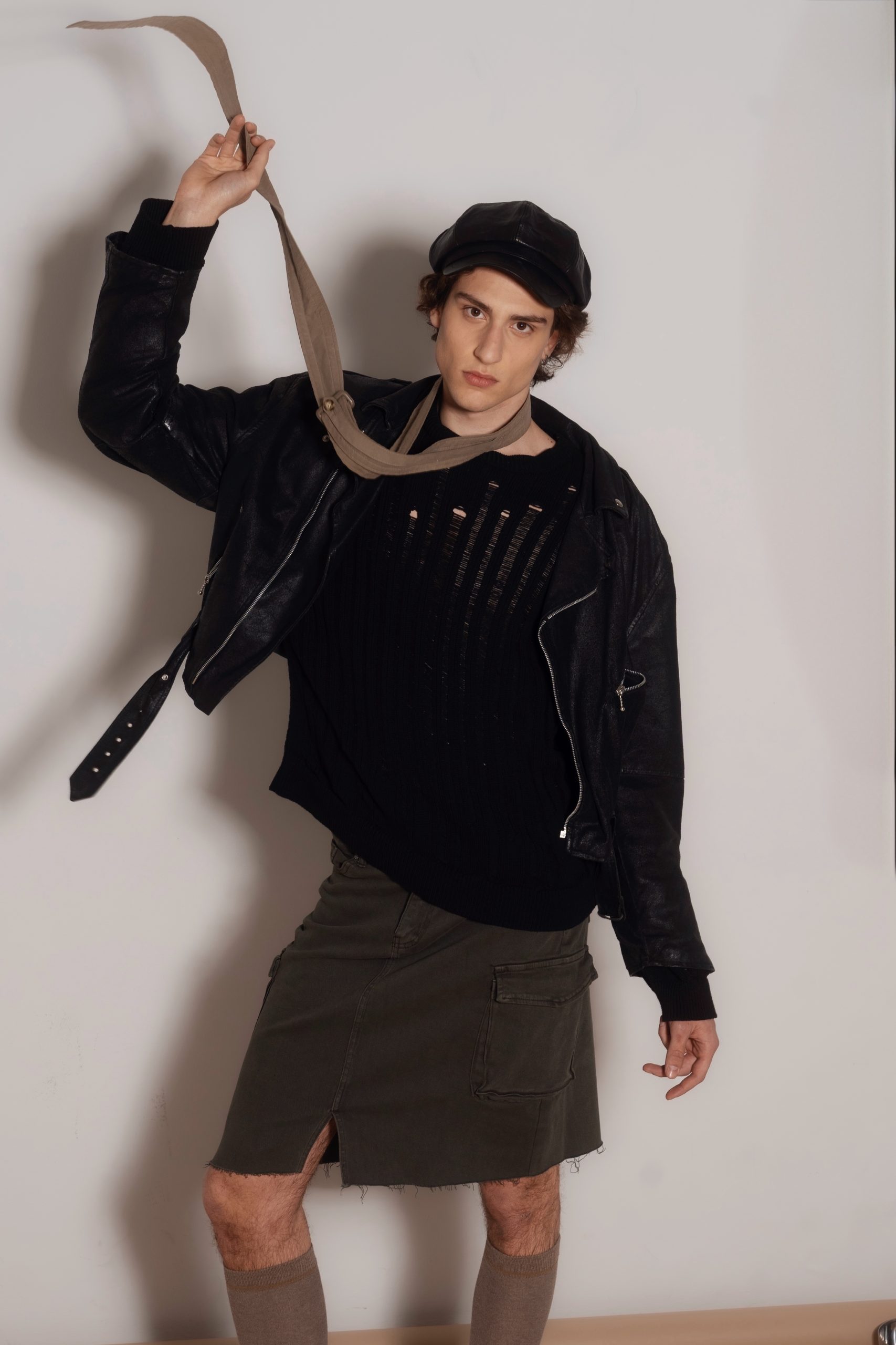 Stylish male model in a trendy outfit, showcasing fashion from an Italian model management agency.